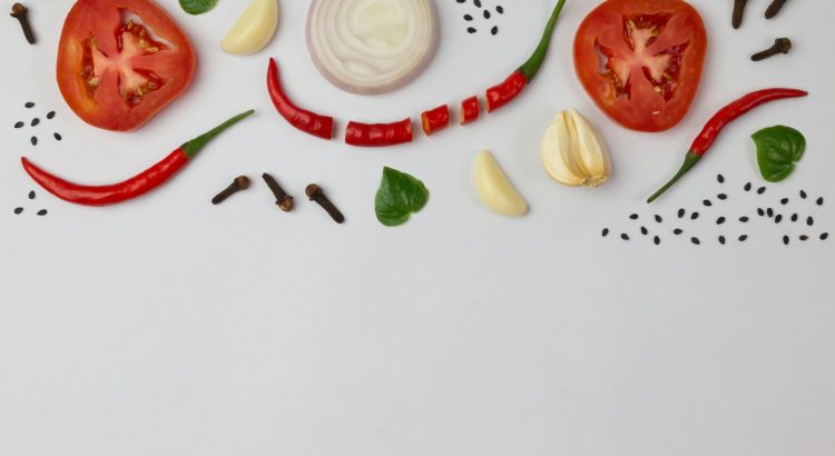 sliced tomato and sliced lemon on white ceramic plate