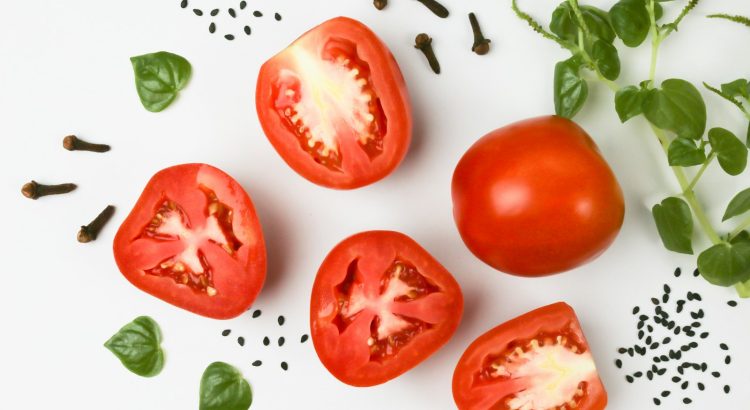 red tomato on white surface